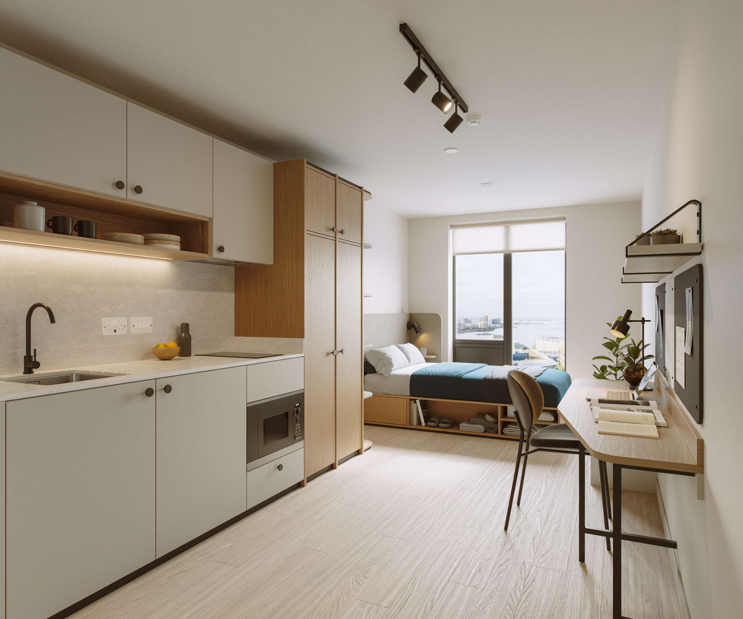 3D rendering of a studio with a kitchenette, desk, and bed beside the window