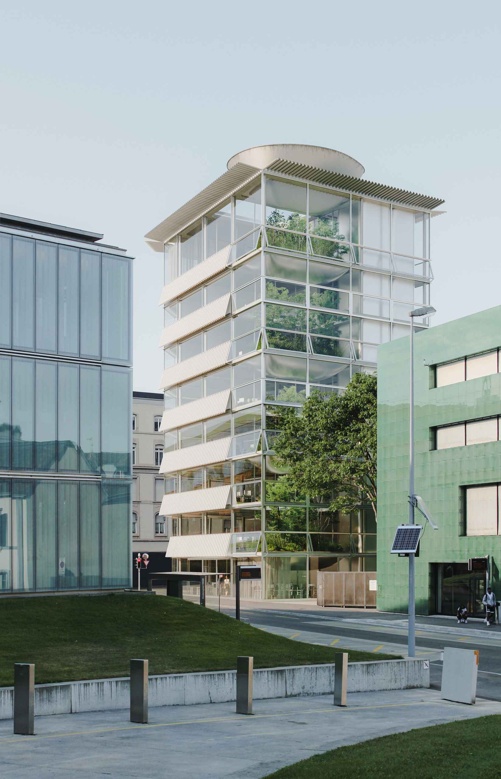 Aerial photorealistic exterior 3D Rendering of a modern multifunctional complex in an urban context in Washington. Still CG image produced by Scuares, an architectural visualization studio