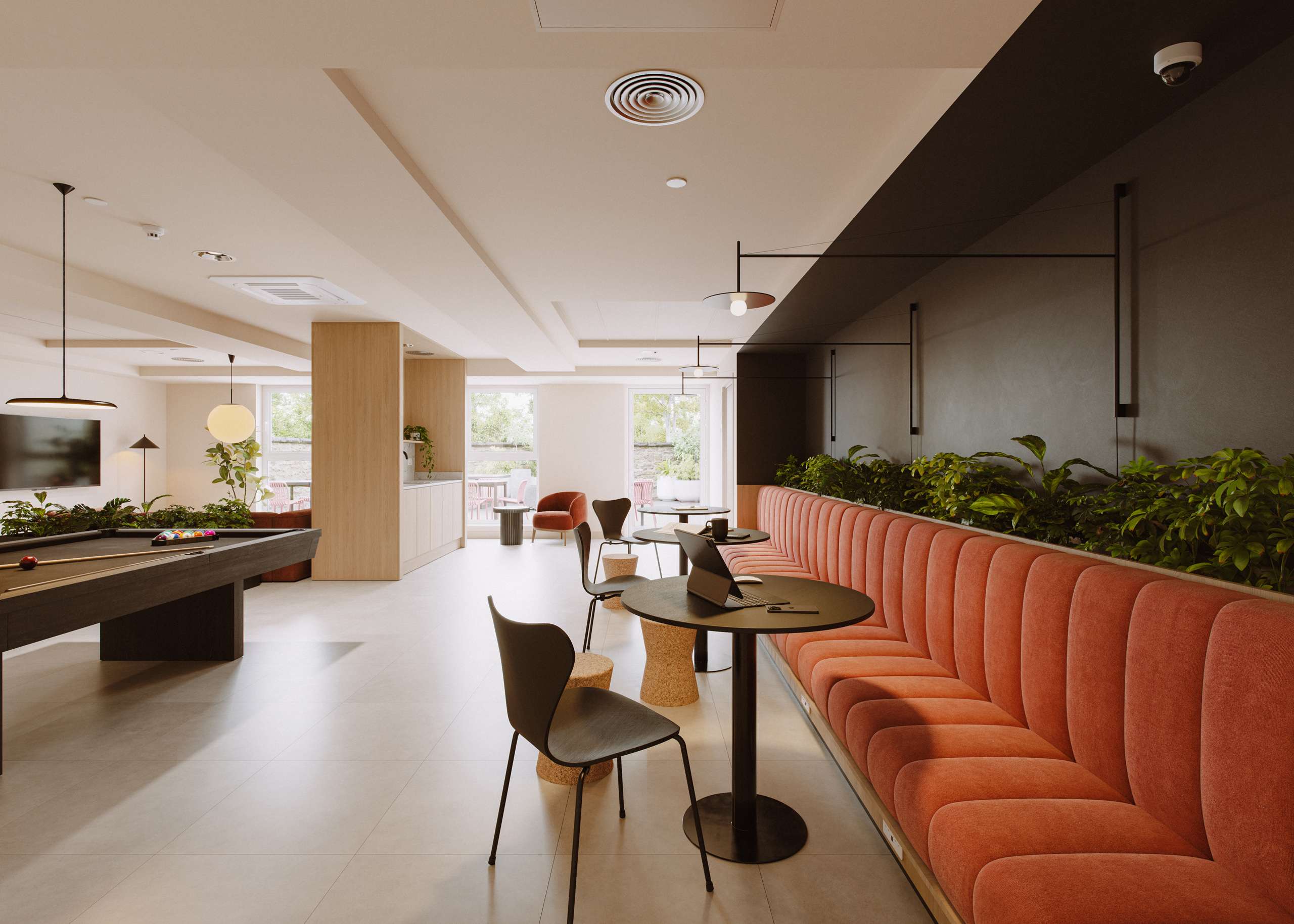 3D rendering of a communal lounge with an orange banquette and pool table