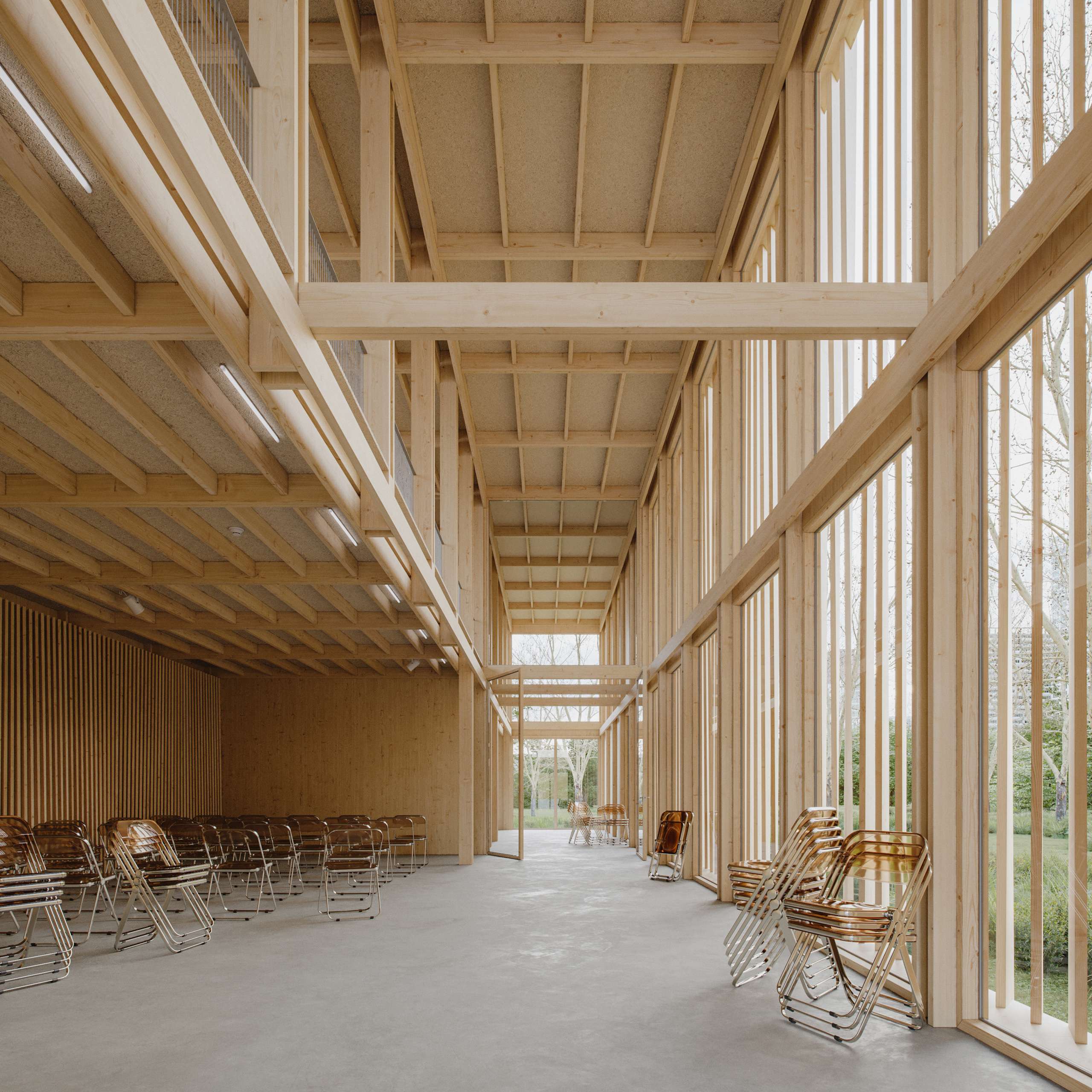 3D rendering of a tall timber exhibition hall with stairs, seating, and full-height glazing